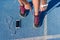 Runner tying running shoes laces on race run track