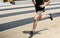 Runner with wet shoes after exiting the steeplechase while racing on a track