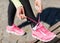 Runner woman lacing trainers shoes