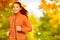 Runner woman running in fall autumn forest