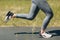 Runner woman in running shoes closeup of woman sporty legs. Female jogging.