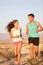 Runners - Active fitness couple running laughing