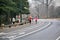 Runners in Central Park roadway practice social distancing