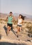 Runners couple running long distance ultra trail run race. Runner man and sport woman training cardio outside in cross