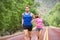 Runners - couple running training marathon on road