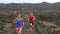 Runners - Determined Athletic Couple Running In Arid Landscape