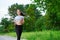 Running asian woman on running track. Morning jogging. The athlete training
