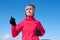 Running athlete woman sprinting during winter training outside in cold snow weather. Close up showing speed and movement