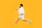 Running into busy life. Busy man in midair yellow background. Energetic hipster run with laptop pc. Busy schedule