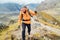 Running caucasian man with backpack and trekking poles by Makalu Barun Park route near Khare. Mera peak climbing acclimatization