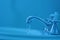 Running faucet blue background
