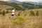 Running fitness man sprinting outdoors with beautiful mountains landscape on background. Caucasian sport male runner training for