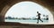 Running, fitness and man in tunnel by harbor for marathon training, exercise and cardio workout. Sports, runner and
