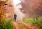 Running in foggy autumn forest