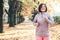 Running girl portrait in atumn park