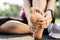 Running injury leg accident- sport woman runner hurting holding painful sprained ankle in pain. Female athlete with joint or