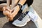 Running injury leg accident- sport woman runner hurting holding painful sprained ankle in pain. Female athlete with joint or
