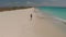 Running kid on Klein Curacao island. Drone shooting