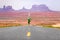 Running man - runner on road by Monument Valley