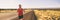 Running man training for triathlon sport run race in Hawaii. Banner panorama landscape sunset nature, triathlete runner