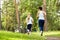 Running mother and daughter. woman and child jogging in a park. outdoor sports and fitness family