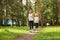 Running mother and daughter. woman and child jogging in a park. outdoor sports and fitness family