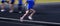 Running Relay Race on Track Blurred Legs Speed Blur