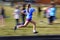 Running Relay Race on Track Blurred Legs Speed Blur