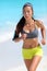 Running runner jogging training cardio on beach in sportswear