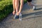 Running shoes. Barefoot running shoes close up. male athlete tying laces for jogging on road. Runner ties getting ready