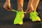 Running shoes. Barefoot running shoes closeup. Female athlete ty