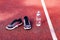 Running shoes and bottle of water