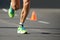 Running shoes, feet and legs close up of runner