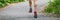 Running shoes panoramic banner of man athlete runner on city road run outdoor panorama of feet and legs