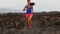 Running sport and fitness runner woman running cross-country trail run training outside training for marathon. Jogging
