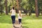 Running sporty mother and daughter. woman and child jogging in a park. outdoor sports and fitness family.