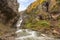 Running  stream from Cascada Del Estrecho  Estrecho waterfall in Ordesa valley, in Autumn season