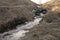 running stream on a hillside.