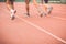 Running track with blur of runner feet in stadium