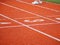 Running track closeup three number rubber orange color