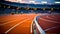 Running track in an empty stadium, bathed in stillness and silence