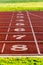 Running track with numbers at the stadium. Sports background