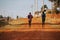 Running training in Kenya. A group of Kenyan runners prepare for a marathon and run on red soil. Marathon running, Track and Field