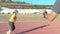 running training in the stadium under the guidance of a coach with a stopwatch, weight loss