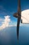 Running turbo airplane propeller in blue sky above the sea