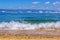 Running waves on the coast of Lake Baikal and mountains in the b