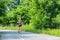 Running woman runner jogging on forest sports path