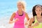 Running women jogging on beach