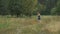 Running young girl teenager in dress on country road