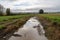 runoff from farm fields fills stream with cloudy, murky water